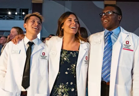 Student receiving white coat