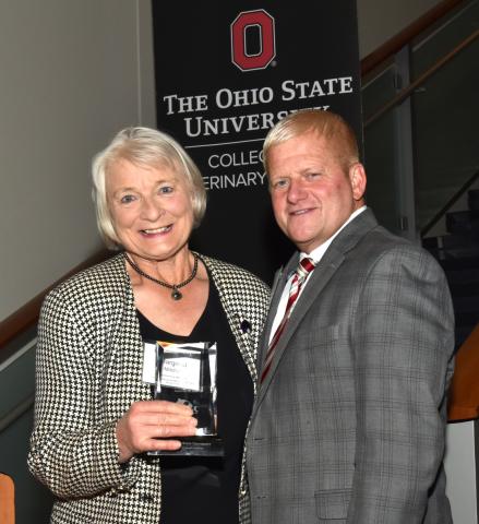 Dr. Margaret Mitchell accepting the award on Dr. Hull's behalf with Dean Moore