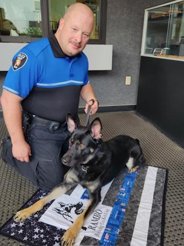 Officer Devin Alford remained by 14-month-old German Shepherd Rambo’s side after he suffered a gunshot wound and was airlifted to Ohio State Veterinary Medical Center.
